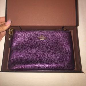 Purple coach clutch